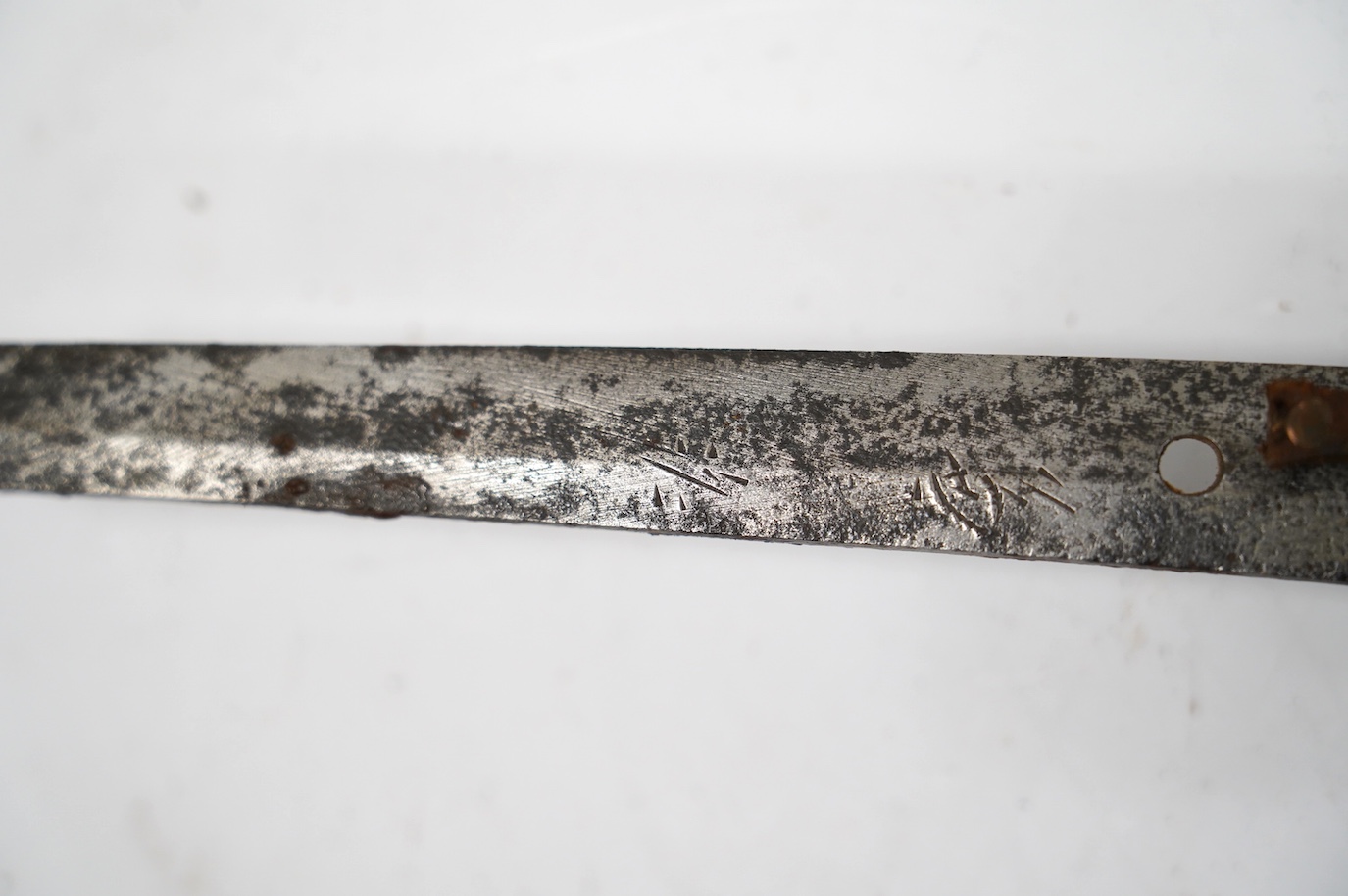 A Japanese WWII army officer’s sword Katana, blade 57.9cm, signed and dated with Seki Arsenal stamp, retaining good polish, in shin gunto mounts with leather combat cover on hilt and scabbard, the latter with plate stamp